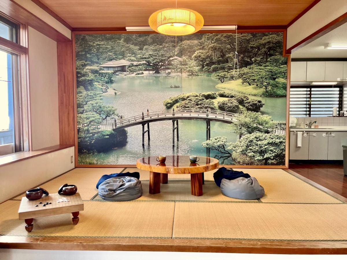 バーベキューもできる! 海と浜比嘉大橋を一望できる宿 Henza Buitenkant foto